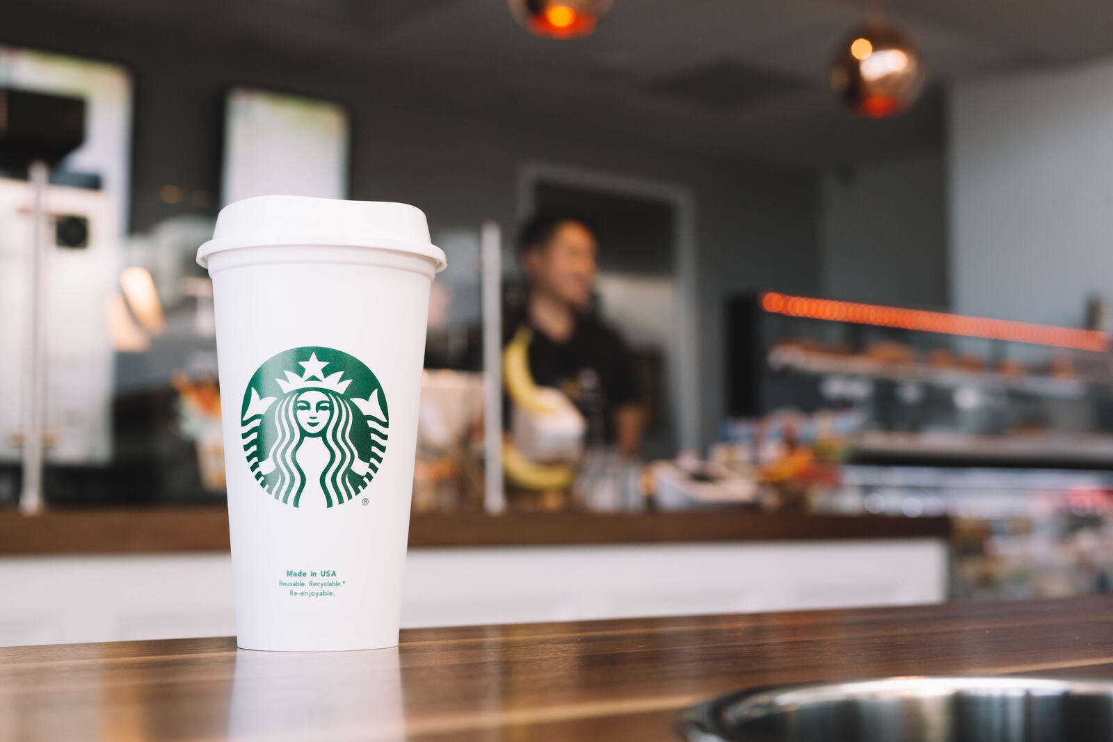A hot cup on the butcher-block counter at The Bean Counter